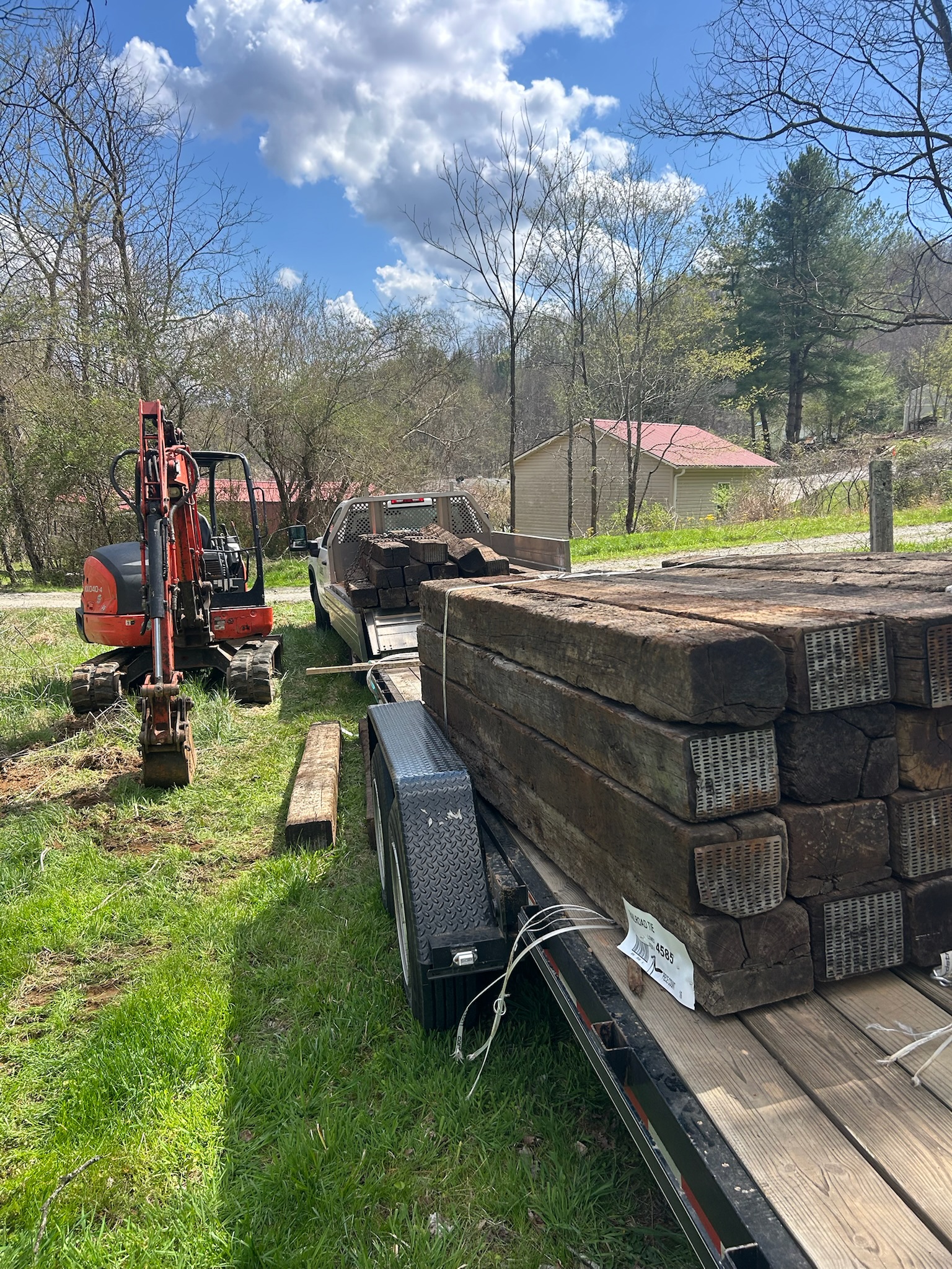 Kubota and trailer with railroad ties